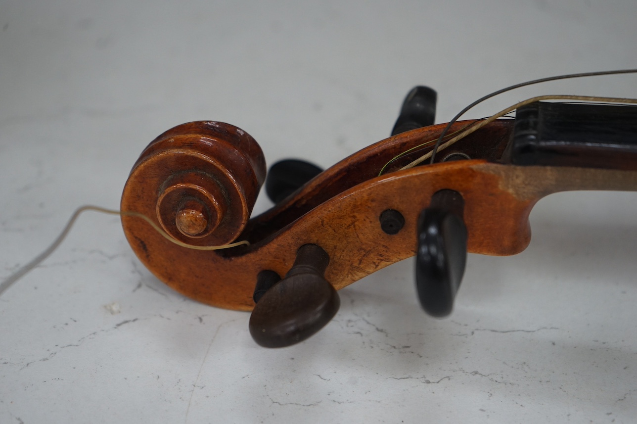 A cased full length violin, circa 1900 with bow, bears Stradivarius label to the interior. CITES Submission reference WVME8714